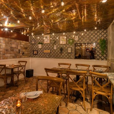 Restaurant interior, dining area with set tables.