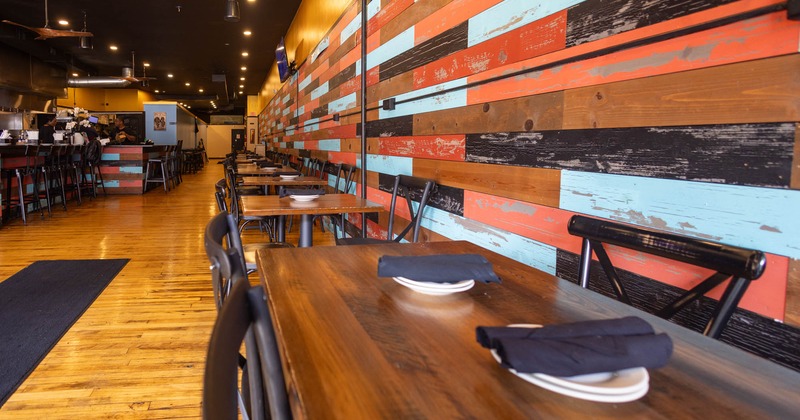 Restaurant interior with wooden tables