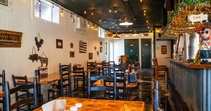 Interior, tables and chairs in dining area