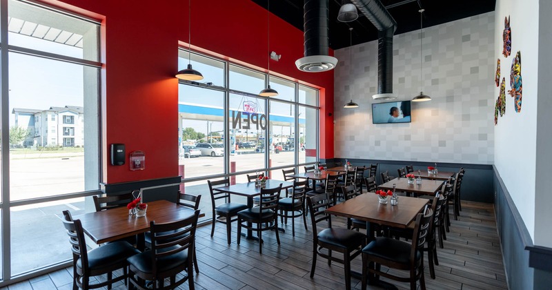 Inside, seating area with tables and chairs