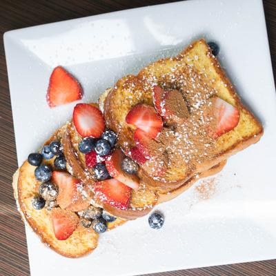 French Toast with sugar free syrup, berries, bananas, cinnamon, and powdered sugar.