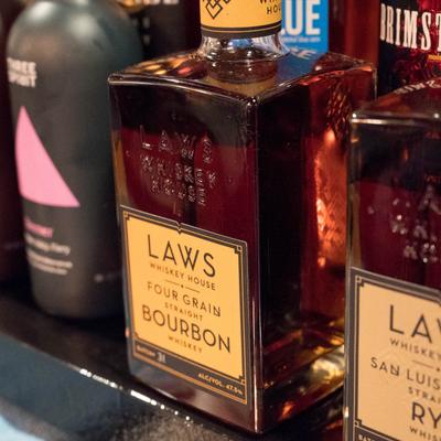 Bourbon bottles on a shelf.