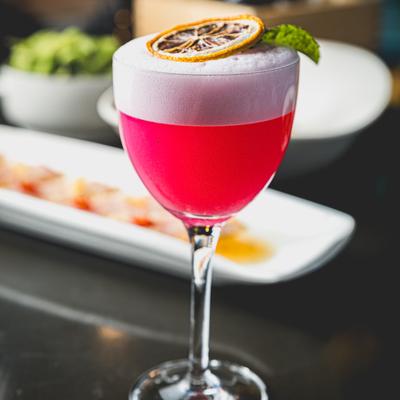 A glass of Sopo Fizz cocktail.