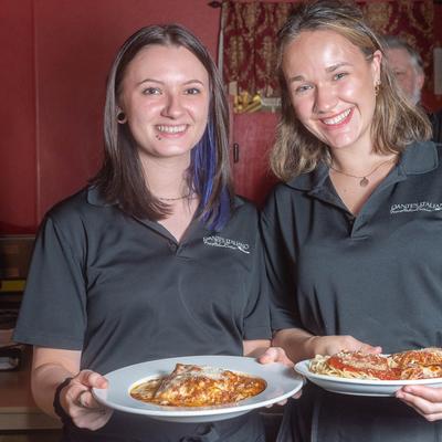 Staff carrying food.