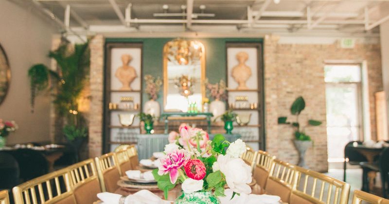 Interior, a set dining table with tableware and flowers as decoration