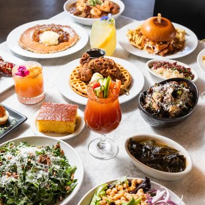 Colorful cocktails and dishes arranged on a table.