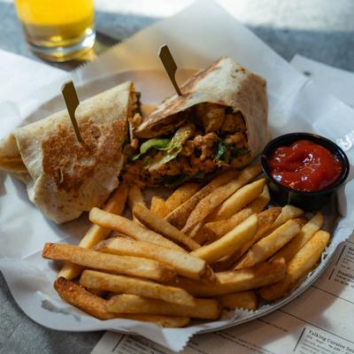 Tandoori Caesar wrap with fries.