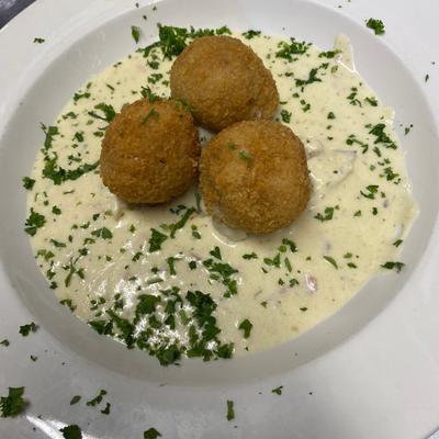 Arancini. Italian rice balls served with three different sauces of your choice..