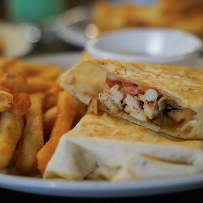 Double Par Spicy Chicken Wrap served with fries.