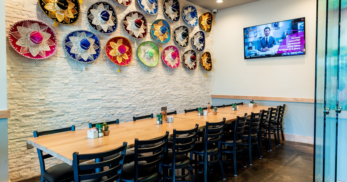 Cozy party room, colorful Mexican sombreros on the wall as decoration