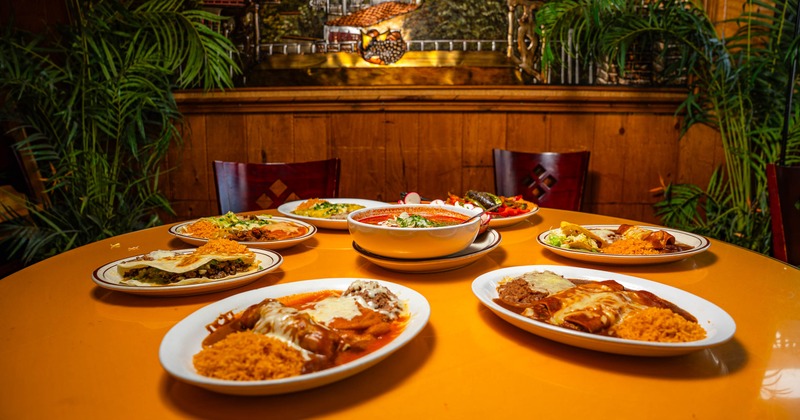 Mexican dishes spread across a restaurant table