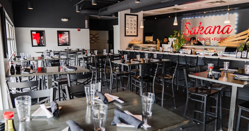 Interior, tables, chairs, and a sushi bar