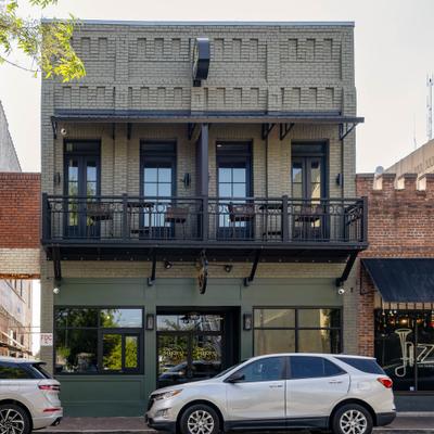 Restaurant building with parked cars.