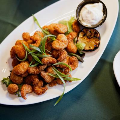 Crispy fried shrimp with a grilled lemon and dipping sauce.