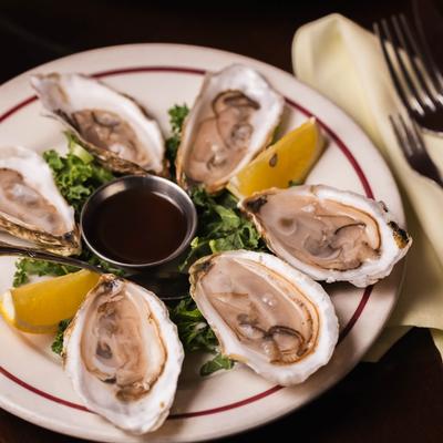 Six oysters on the half shell with homemade mignonette sauce.