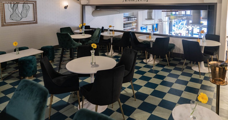 Interior, tables and chairs in dining area