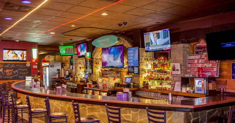 Bar area, neatly lined up bar stools