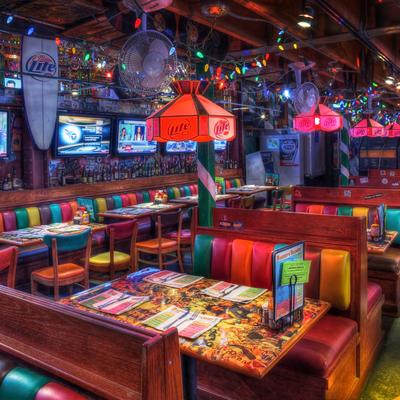 Vibrant diner interior with colorful booths and chairs