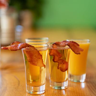 Served strong drink shots with bacon.