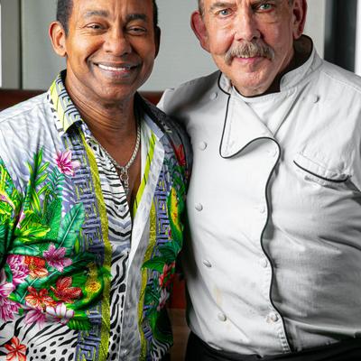 The chef and the owner posing for a photo.