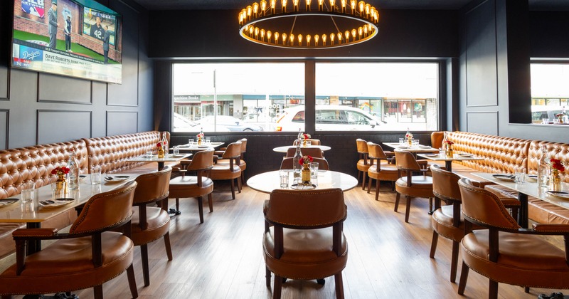 Interior seating area with leather seating and a circular chandelier