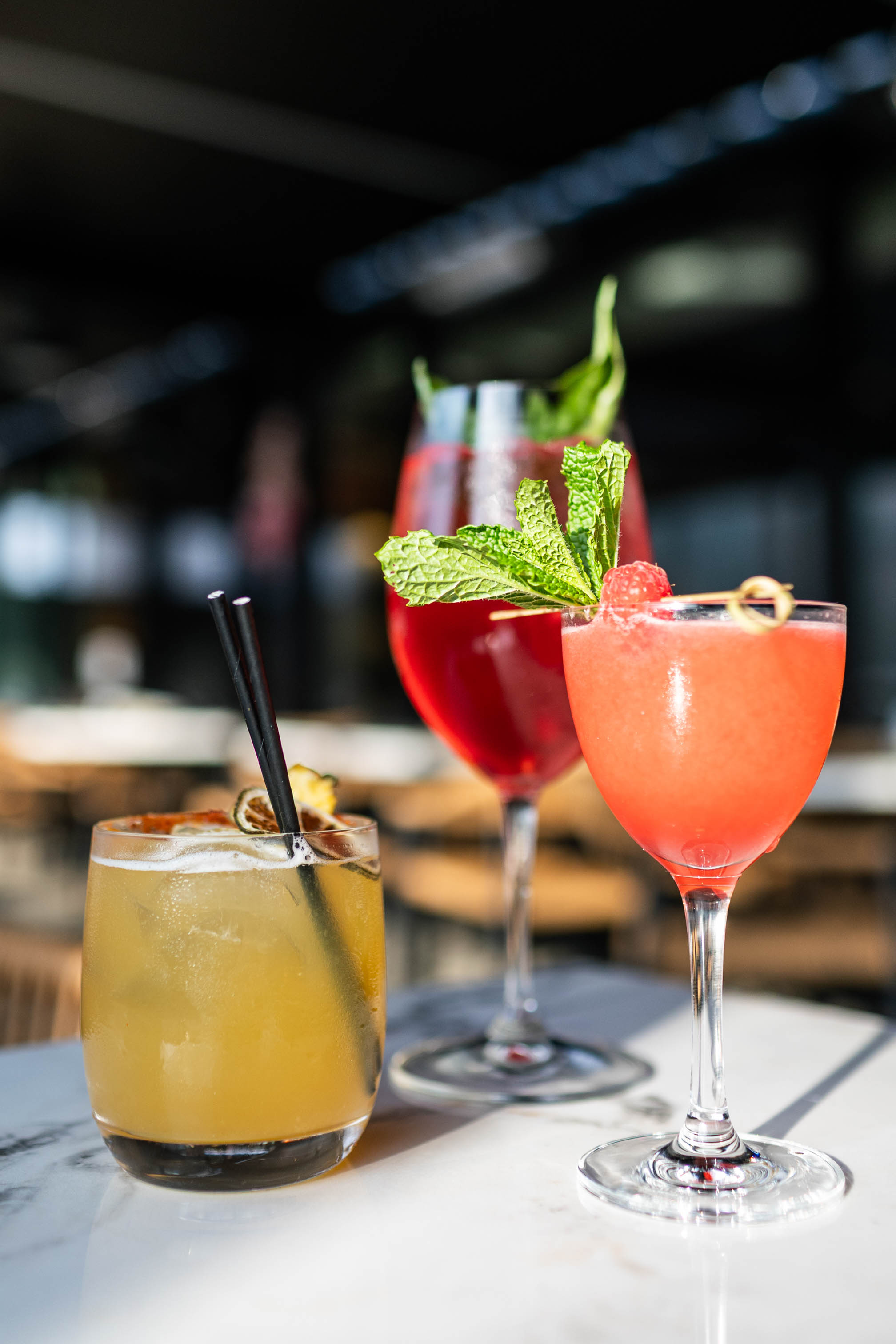 Three colorful cocktails at Supra