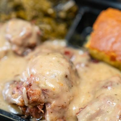 Oxtail Gumbo, with collard greens and cornbread.