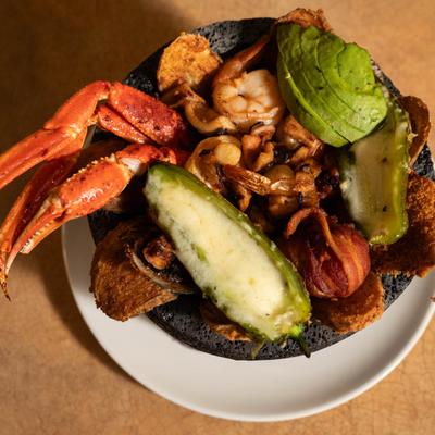 Molcajete Mi General with seafood, stuffed jalapeno, avocado and bacon.