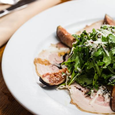 Arugula salad with pears and pecorino cheese.