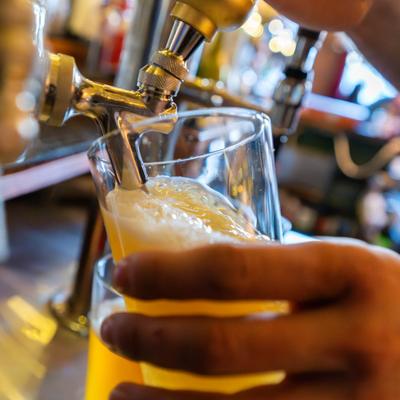 Draft beer being poured.