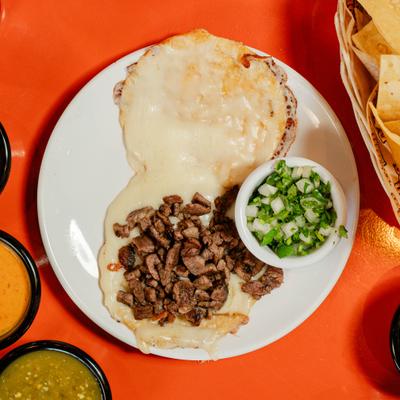 Quesadilla sirloin served with onion cilantro.