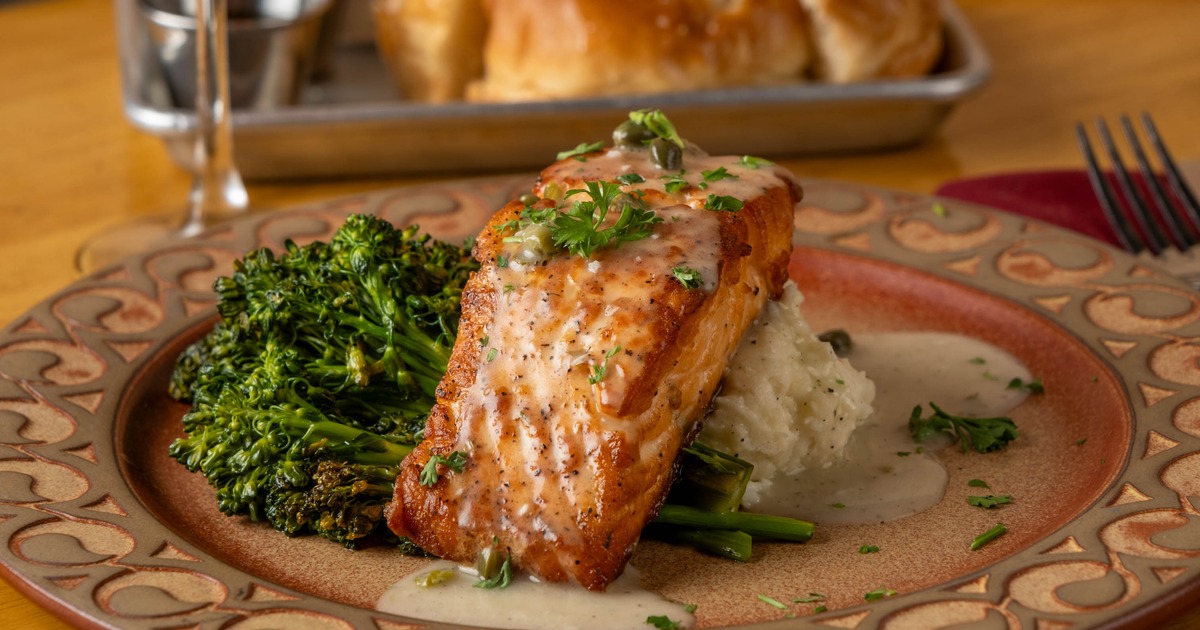 Seared salmon served with broccolini and potato puree