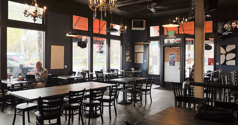 Interior, dining seating, a seated guest by the window