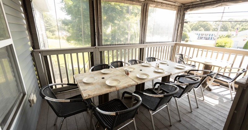 Covered patio area, long table for multiple guests
