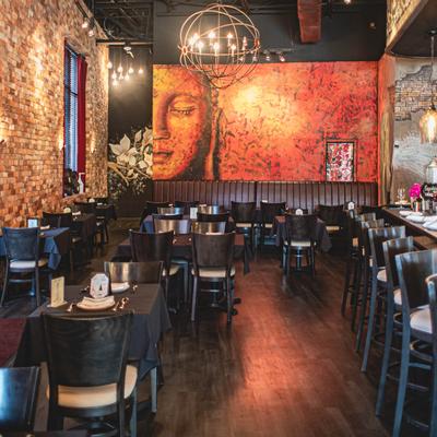 Interior - tables ready for guests, discreet lighting