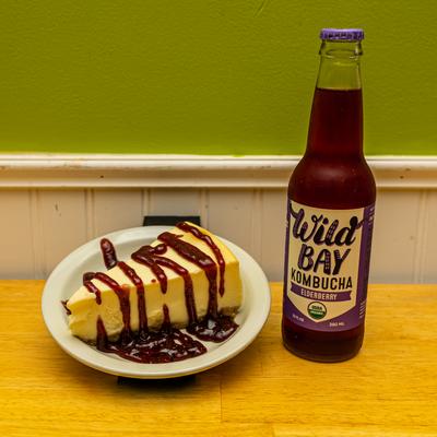 Cheesecake and a bottle of Wild Bay Kombucha