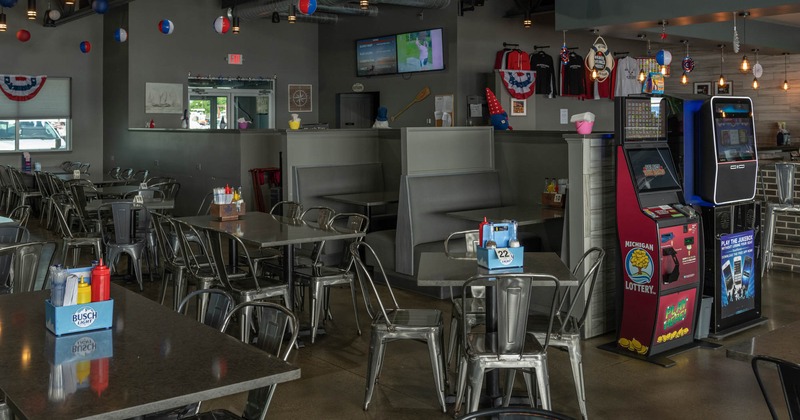 Interior, seating booths, tables and chairs and arcade games