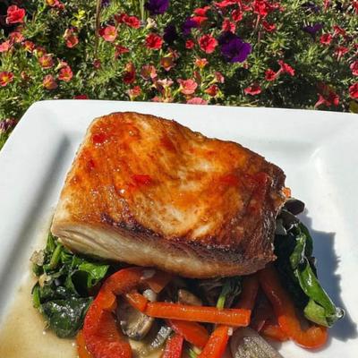 Pan seared Mahi with a sauteed vegetable medley and sweet Thai chili sauce.