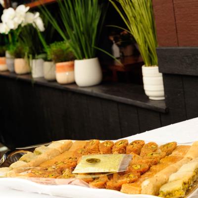 Tray of baklava and other pastries, served.