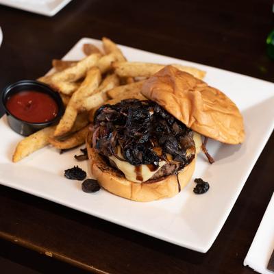 Mushroom cheese burger, served with fries and ketchup dip.
