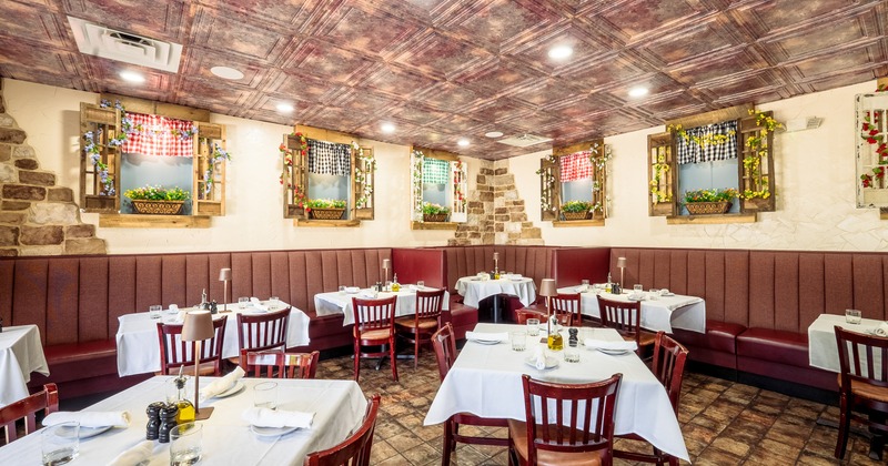 Interior, dining area with benches, tables and chairs