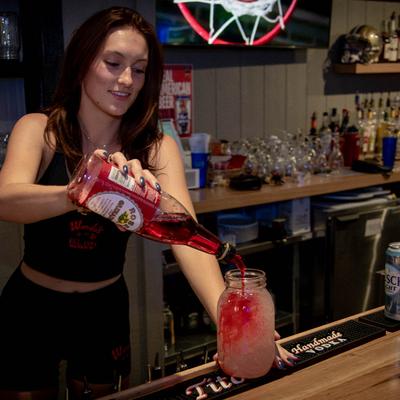 A staff member preparing a beverage.