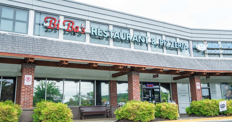Exterior, angleview to restaurant, entrance, sign
