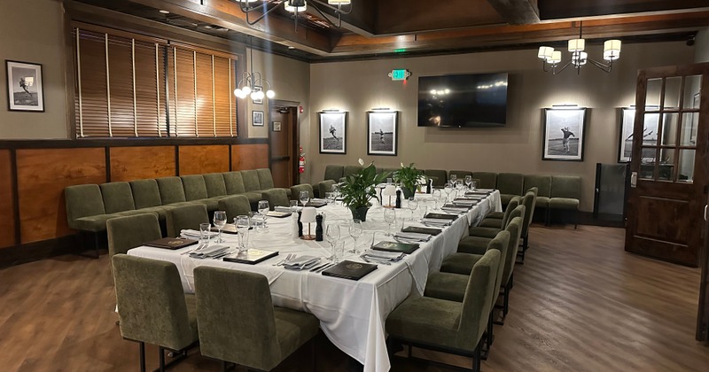 Lujacks private dining room arranged with a long, fully set table for a group event.