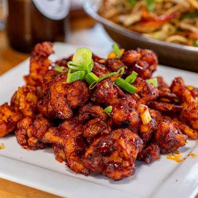 Pan fried crispy cauliflower florets.