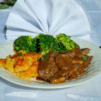 Meatloaf with sides, served on the table.