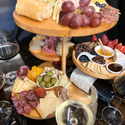 A catering stand with multiple charcuterie boards.