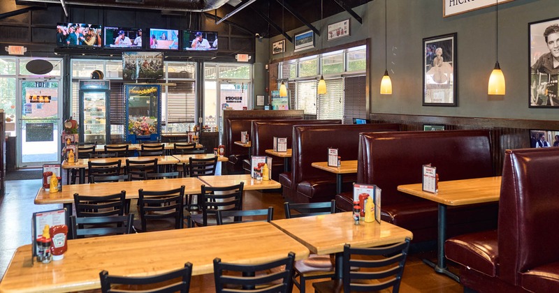 Interior with dining tables and seating booths
