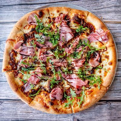 Fig and prosciutto pizza, top view.