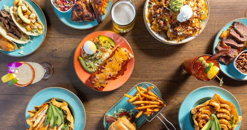 Assortment of menu items served on the table with drinks